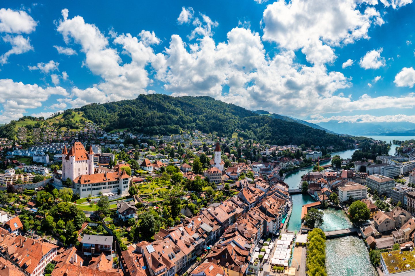Panorama of Thun city with Alps and Thunersee lake, Switzerland. Historical Thun city and lake Thun with Bernese Highlands swiss Alps mountains in background, Canton Bern, Switzerland. iStock 1484654055