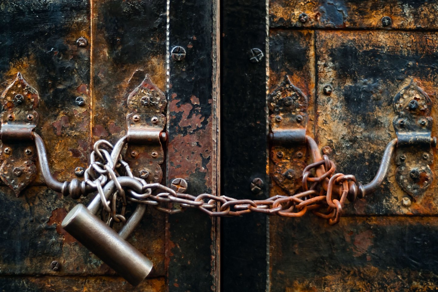 vintage lock on a rusty loop on an iron door, copy space, concept of authentic objects iStock 1098060280 1