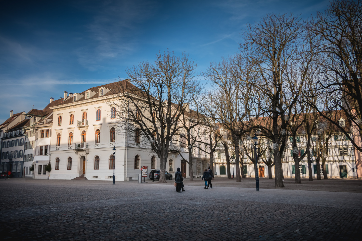 Warmly dressed people walk on cathedral square of Basel iStock 1060604004