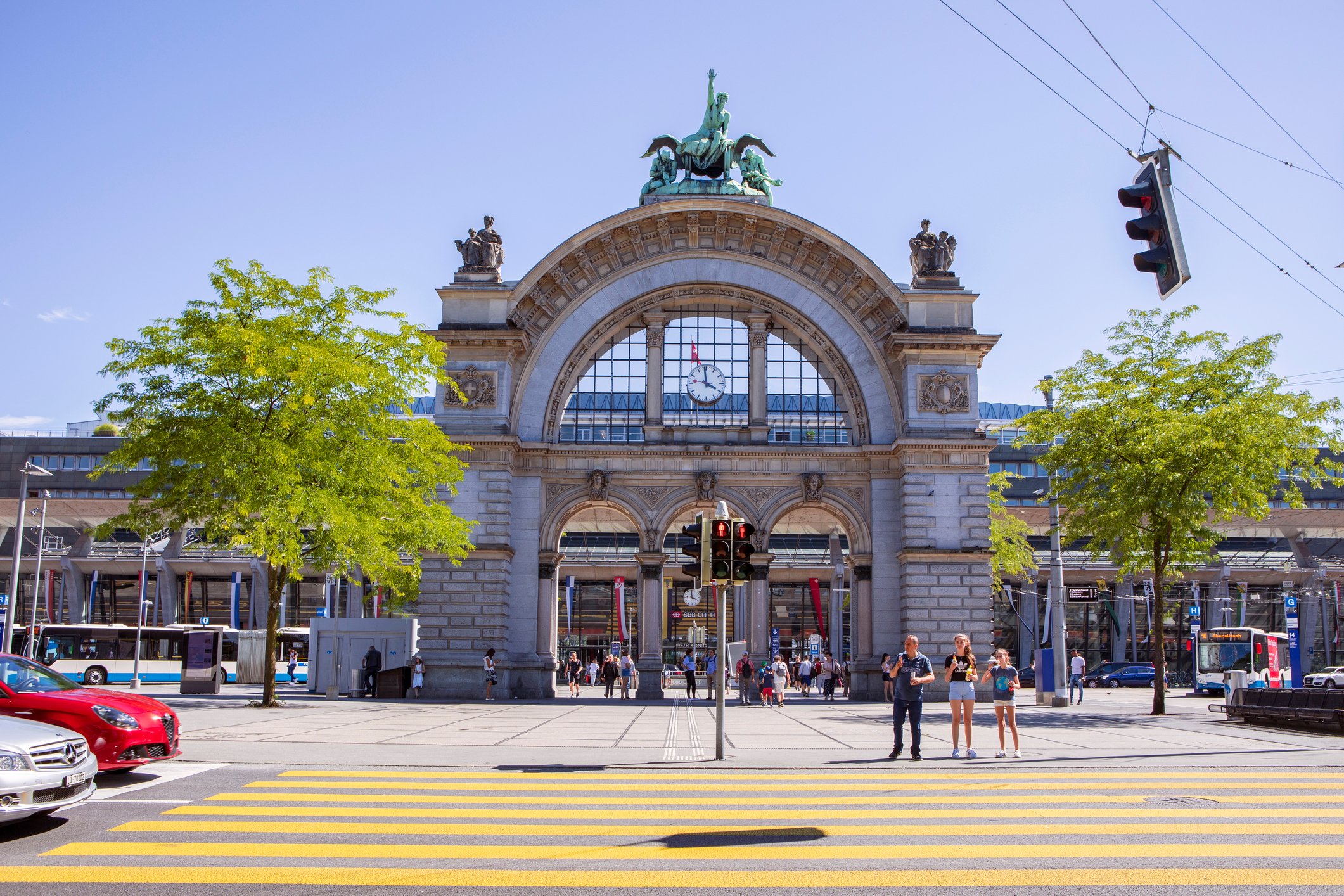 Main Railway Station in Lucerne, zebra crossing, city traffic. Switzerland. iStock 1271210970