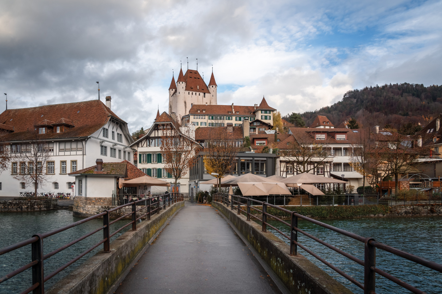 Bridge and view of Thun city with Thun Castle (Schlossberg Thun) on background - Thun, Switzerland iStock 1346269844 6