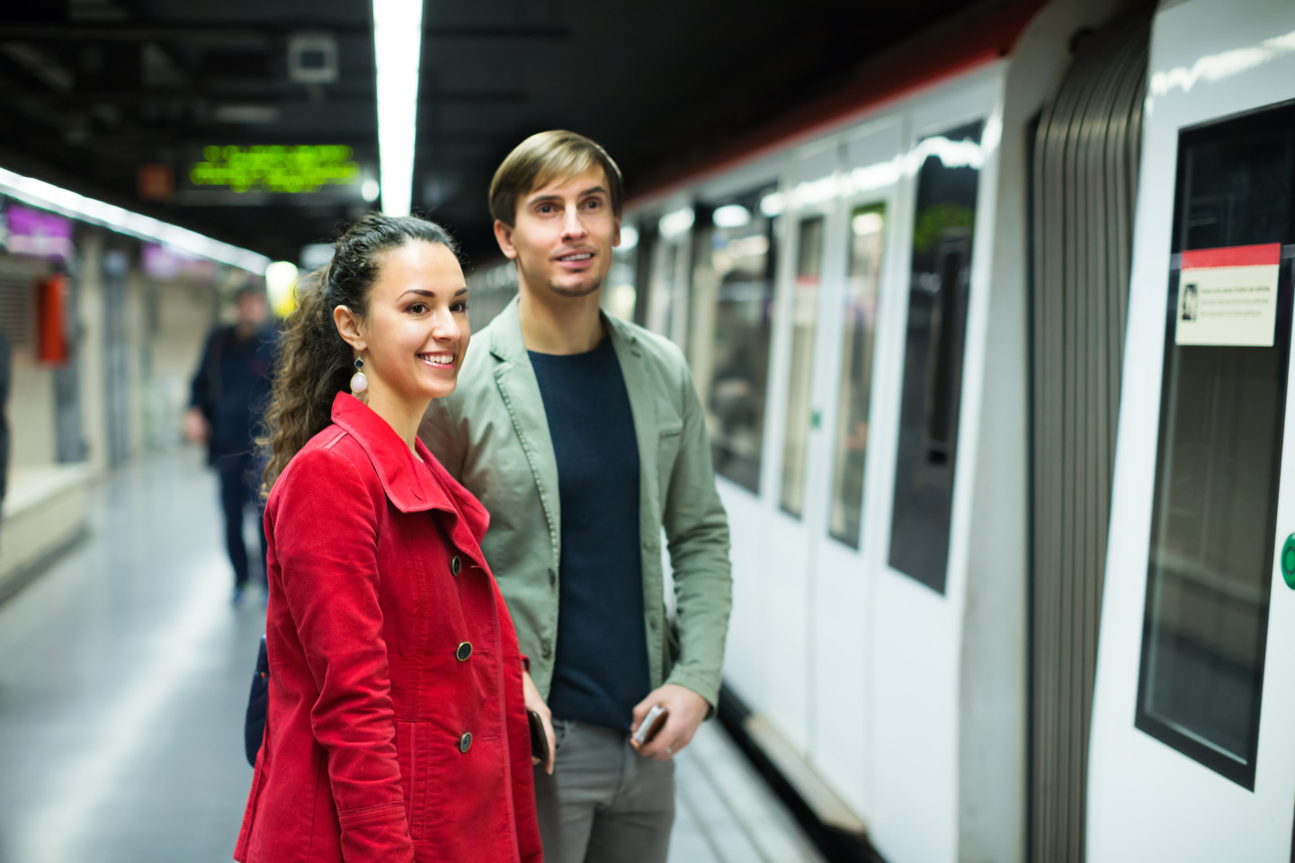 Young couple standing at underground station iStock 531475120 25